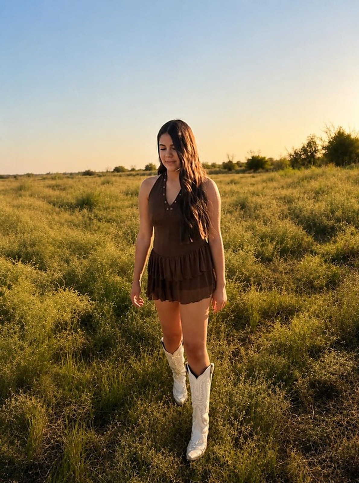 Brown ruffle romper with cowboy boots