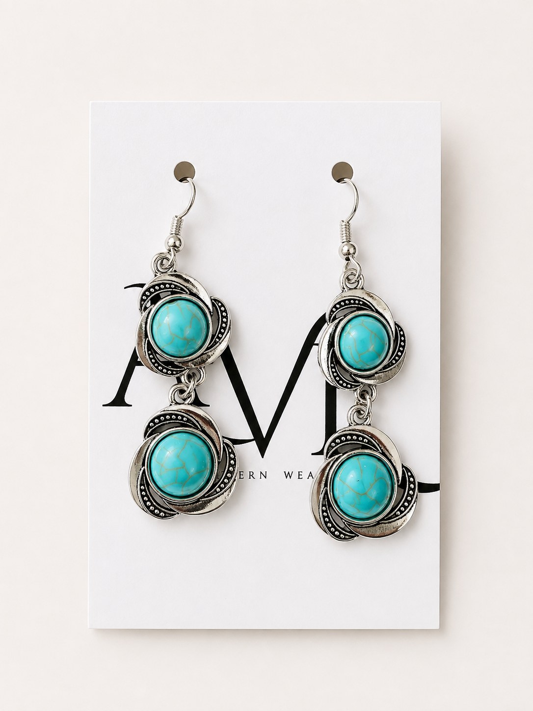 Hanging circle turquoise earrings on AVL card