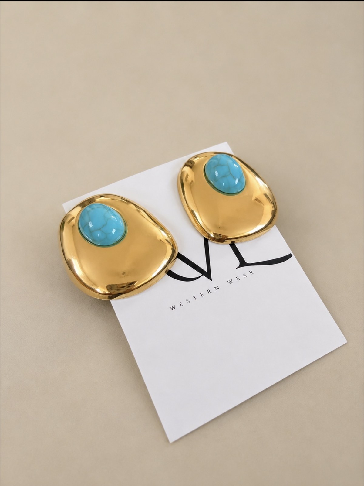Turquoise and gold statement earrings on AVL card