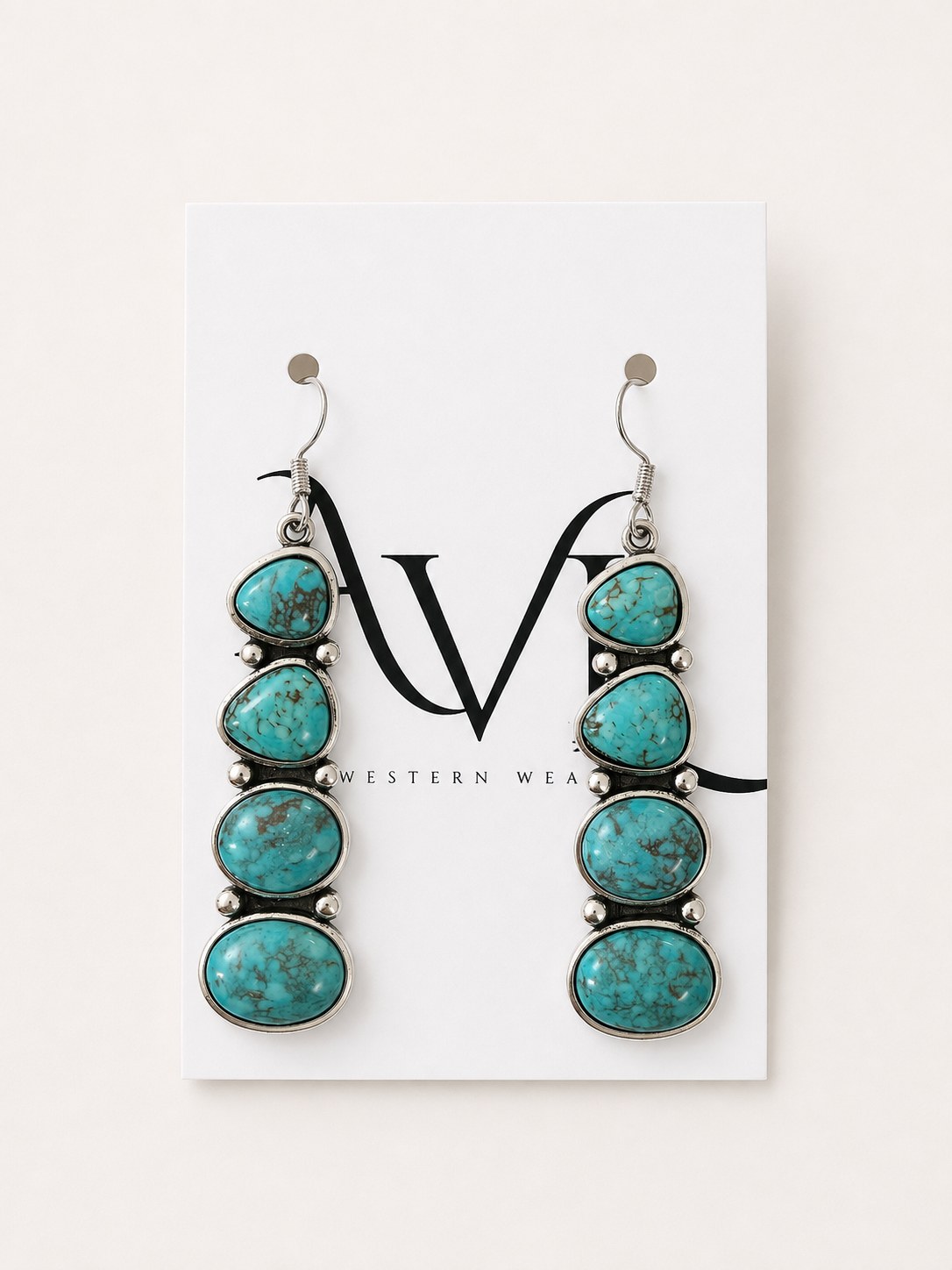 Vintage long turquoise earrings on AVL card